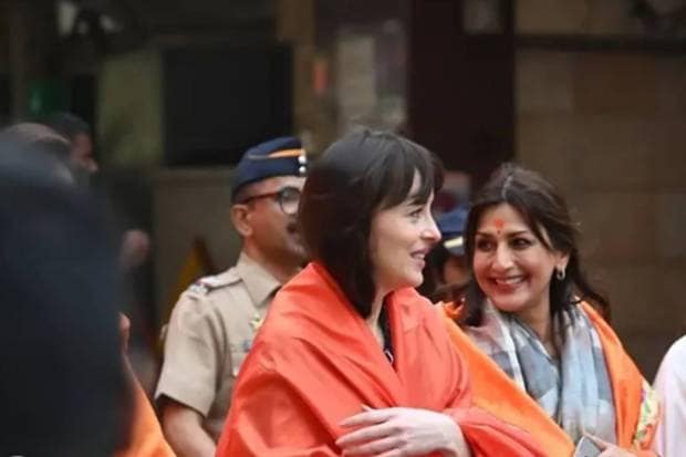 Johnson with Bollywood actor Sonali Bendrea while coming out from the temple. (Photo source: Instagram)