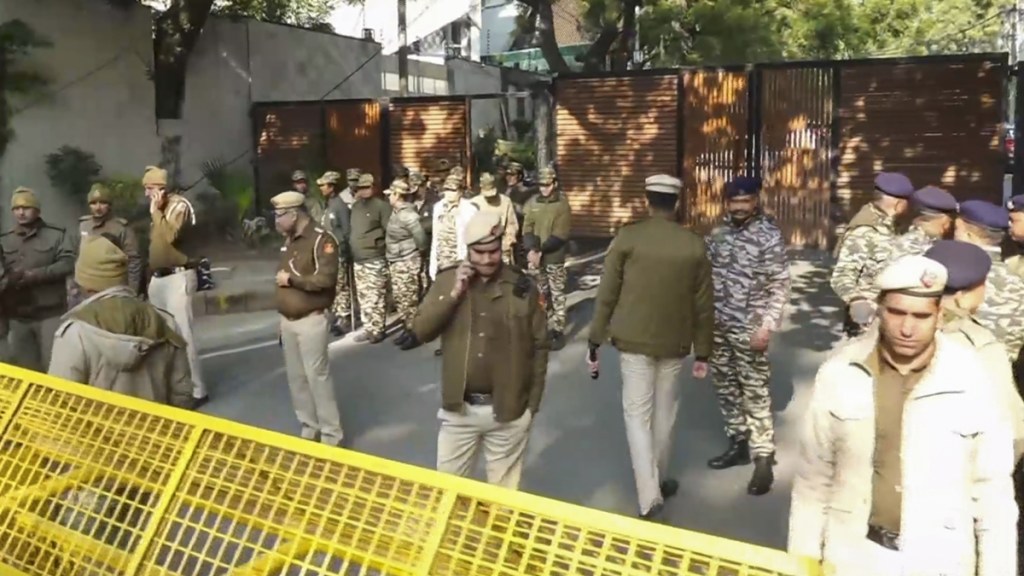 Police and security personnel stand guard at Delhi Chief Minister Atishi’s residence amid heavy security deployment, in New Delhi, Wednesday, Jan. 8, 2025.