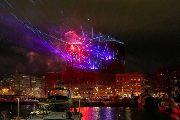 Oslo Municipality rings in the new year with a laser light show from City Hall in Oslo, Norway. (Photo source: Reuters)