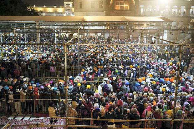 Devotees arrive to pay obeisance at the Golden Temple on the first day of the year 2025, in Amritsar. (Photo source: PTI)