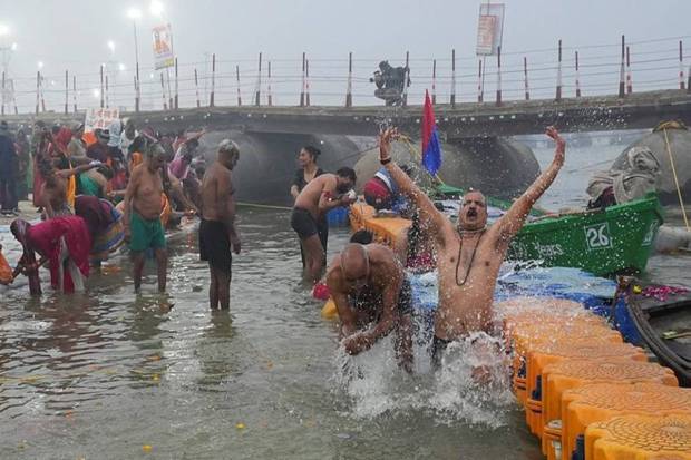 Devotees take a holy dip in the Ganga river. (Photo source: PTI)