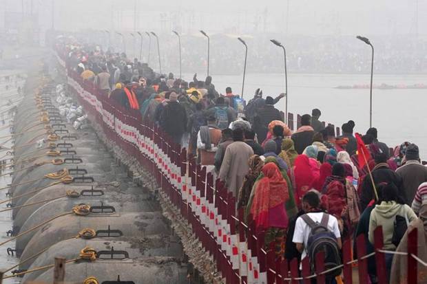 Devotees arrive at Sangam on the first day of Maha Kumbh Mela 2025, in Prayagraj, Uttar Pradesh, Monday. (Photo source: PTI)
