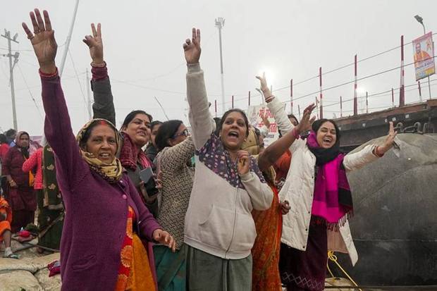 Devotees react as they arrive on the first day of Maha Kumbh Mela 2025. (Photo source: PTI)