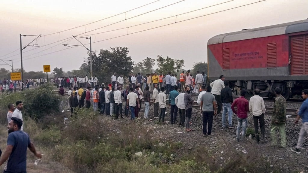 People gather after a train mishap, in Jalgaon district, Maharashtra, Wednesday, Jan. 22, 2025. (PTI Photo)