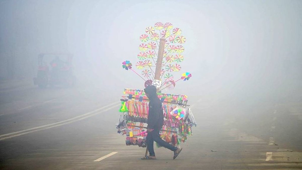 A vendor during a foggy morning, near Sangam in Prayagraj, Thursday, Jan. 2, 2025. (Photo source: PTI) A vendor during a foggy morning, near Sangam in Prayagraj, Thursday, Jan. 2, 2025. (Photo source: PTI)