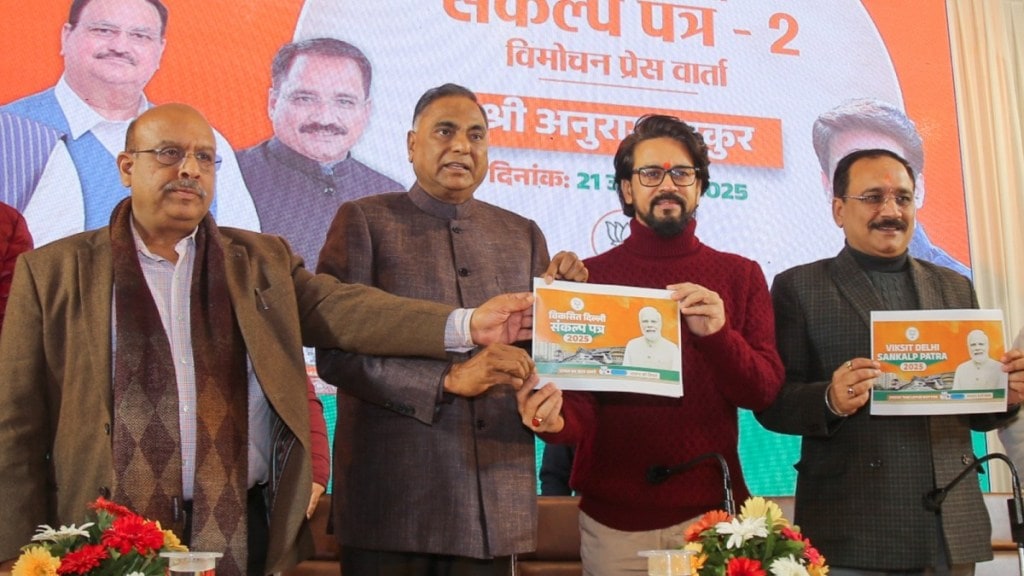 JP MPs Anurag Thakur and Ramvir Singh Bidhuri with Delhi party President Virendra Sachdeva, and party leader Vijender Gupta during the launch of the second part of the party's 'Sankalp Patra' (manifesto). (Image Source: PTI)
