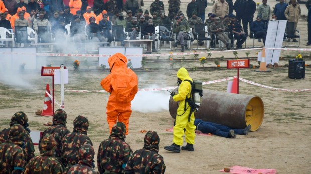 Prayagraj: NDRF, police, and Bomb Disposal Squad members conduct a joint mock drill on nuclear and radiological emergency preparedness ahead of the Maha Kumbh Mela. (PTI Photo)