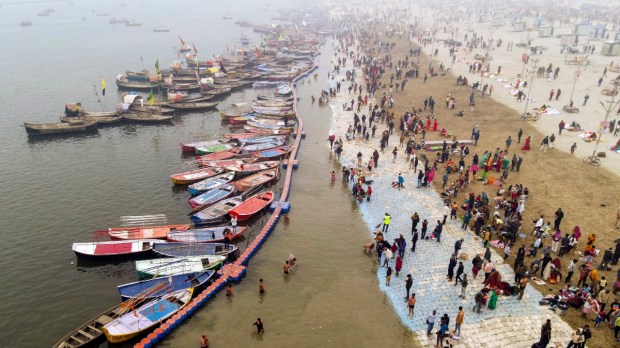 Prayagraj: Devotees take a holy dip at Sangam ahead of the Maha Kumbh Mela. (PTI Photo)