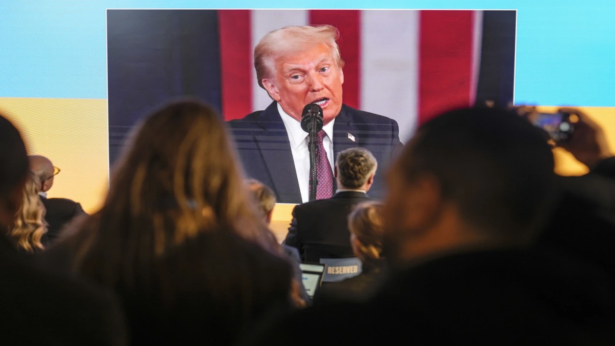 People watch the inauguration of Donal Trump on screens at the Ukraine house alongside the World Economic Forum in Davos, Switzerland, Monday, Jan 20, 2025. . (Image Source: AP)