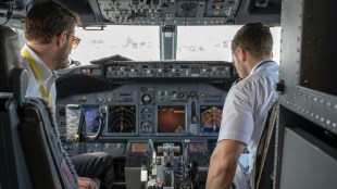 pilots in plane cockpit