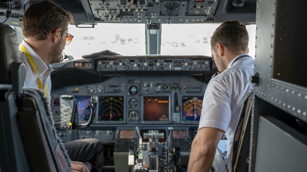 pilots in plane cockpit