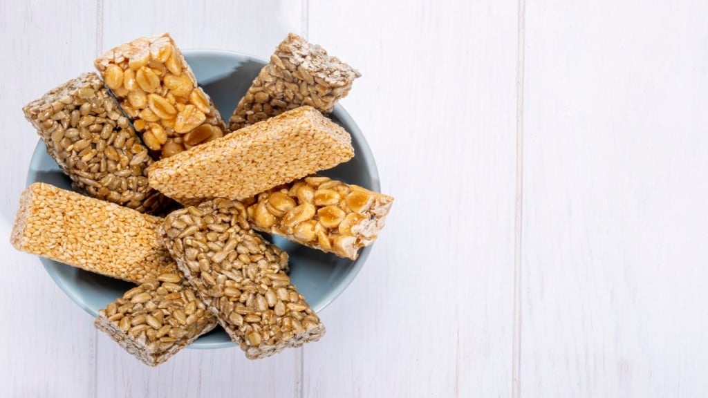 Gazak and chikki, chikki eating, chikki box, chikki gajak, chikki sesame, chikki recipe, difference between gajak and chikki, how many calories in til chikki, is chikki fattening, is sesame chikki healthy, chikki and Yash, gajak and chikki difference, is chikki good for weight loss, health news, wellness news,