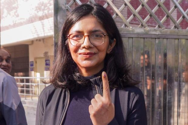 Rajya Sabha MP Swati Maliwal shows her finger marked with indelible ink after casting vote during the Delhi Assembly elections.