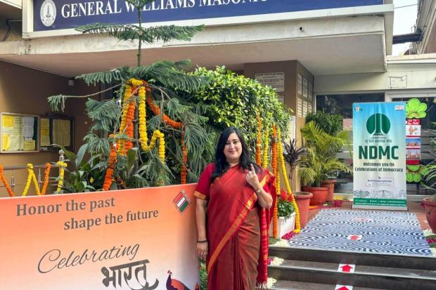 BJP MP Bansuri Swaraj shows her inked finger after casting her vote at a polling booth during the Delhi Assembly elections.