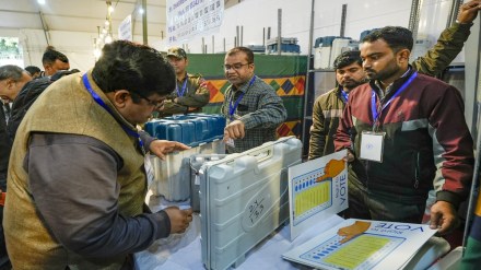 Polling officials collect Electronic Voting Machine (EVM) and other election material at a distribution center on the eve of the Delhi Assembly elections, at Gole Market in New Delhi, Tuesday, Feb. 4, 2025. (PTI Photo) Polling officials collect Electronic Voting Machine (EVM) and other election material at a distribution center on the eve of the Delhi Assembly elections, at Gole Market in New Delhi, Tuesday, Feb. 4, 2025. (PTI Photo)