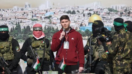 Russian-Israeli Sasha (Alexander) Troufanov, a hostage held in Gaza since the deadly October 7, 2023 attack, speaks as he is released by Palestinian Hamas and Islamic Jihad militants as part of a ceasefire and a hostages-prisoners swap deal between Hamas and Israel in Khan Younis, in the southern Gaza Strip, February 15, 2025. REUTERS/Ramadan Abed