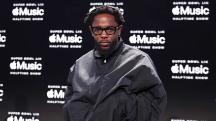 Fresh off his Grammy wins, the 37-year-old rapper took the stage on top of a car, delivering a medley of hits while incorporating sharp lyrical jabs at rival Drake.