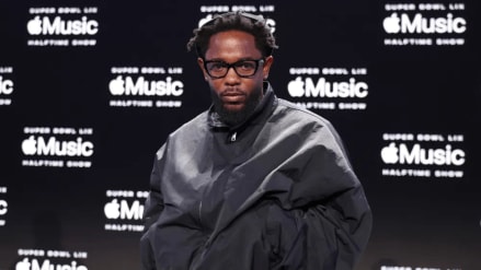 Fresh off his Grammy wins, the 37-year-old rapper took the stage on top of a car, delivering a medley of hits while incorporating sharp lyrical jabs at rival Drake.