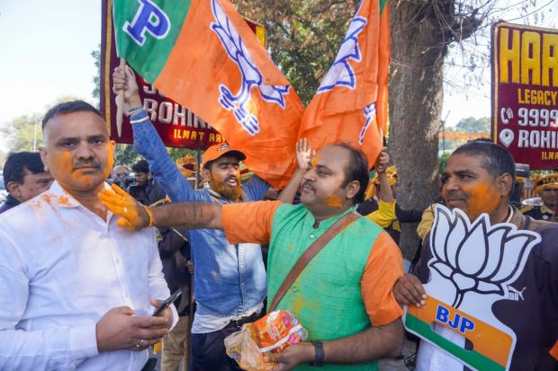 BJP supporters shared a moment of joy and celebration in the Ramleela Ground among their victorious candidates. PM Modi said the people's power won, adding that the party's poll performance shows that good governance triumphs. (Image: PTI)
