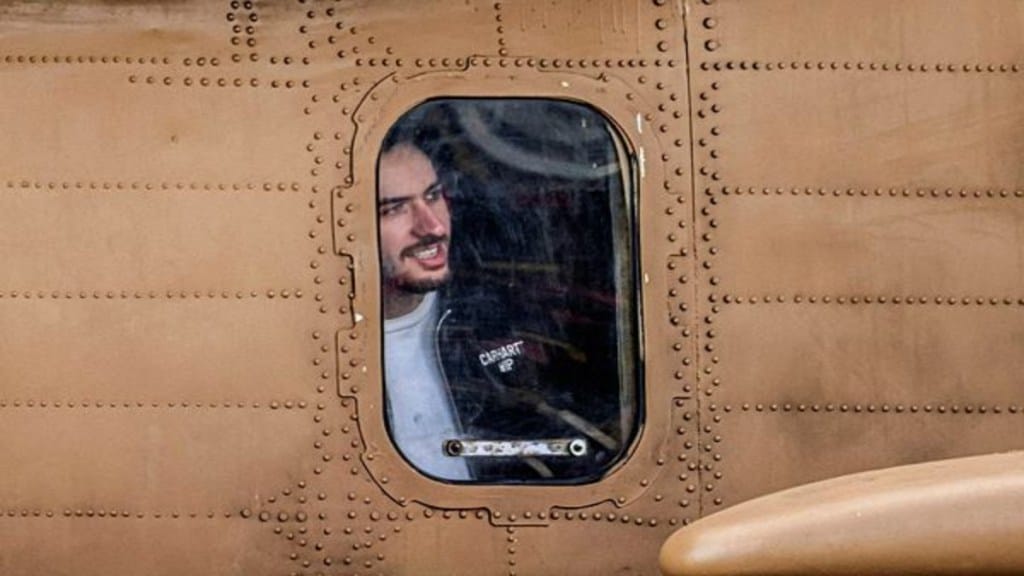 Omer Shem Tov, a hostage who was held in Gaza since the deadly October 7, 2023 attack, sits inside a helicopter after he was released from captivity as part of hostages-prisoners swap and a ceasefire deal between Hamas and Israel, at Beilinson Schneider complex in Petah Tikva, Israel, February 22, 2025. REUTERS/Nir Elias