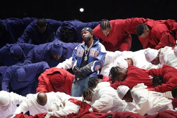 The visually aesthetic performance by Kendrick Lamar was not received well by netizens. He shared the stage with SZA and Serena Williams who had a surprise performance in the show. (Image: Reuters)