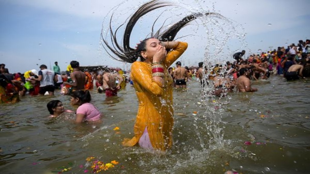 A devotee takes a holy dip at Sangam during the ongoing Maha Kumbh Mela 2025, ahead of Maha Shivaratri festival, in Prayagraj. (Photo: PTI)