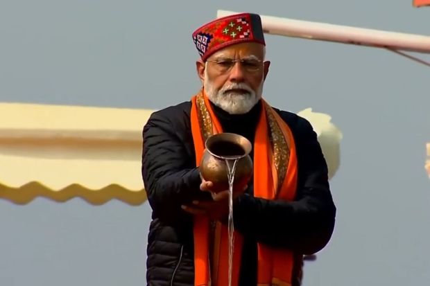 Offering jal to holy river Ganga is considered auspicious. PM Modi as he offers his prayers at the Areal Ghat. (Image source: PTI)