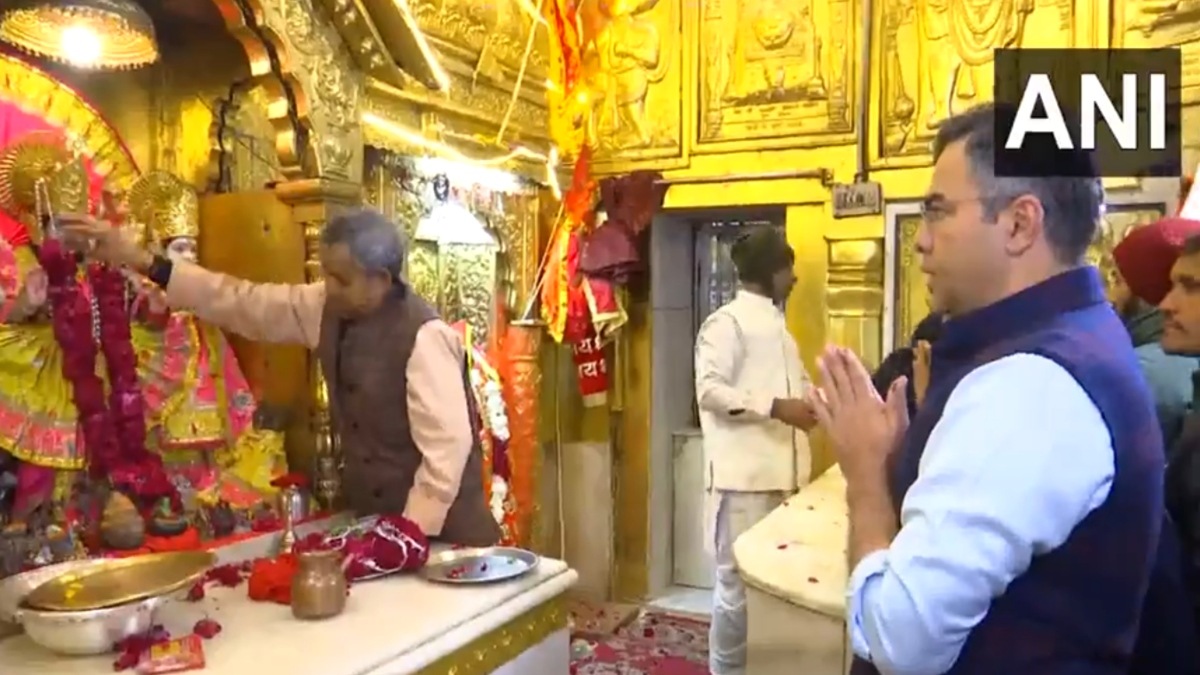 BJP candidate from New Delhi assembly constituency, Parvesh Verma offers prayers at Hanuman Temple, Connaught Place