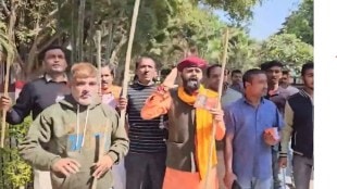 A group of men says to remember Pulwama Heroes to Valentine couples in a park.