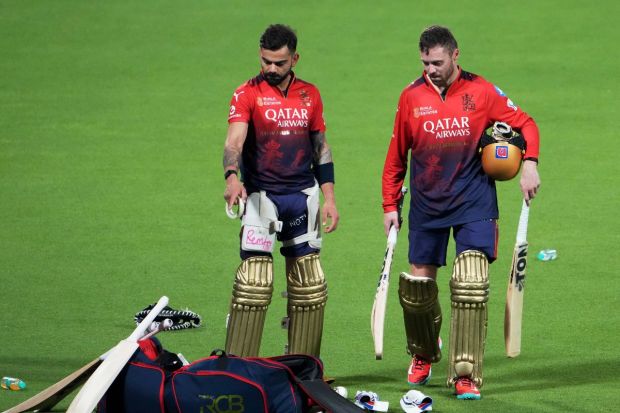 RCB players, Virat Kohli and Phil Salt as they conclude a practice session at Eden Gardens discuss strategy and defence before their IPL 2025 debut match against KKR. (Image: PTI)