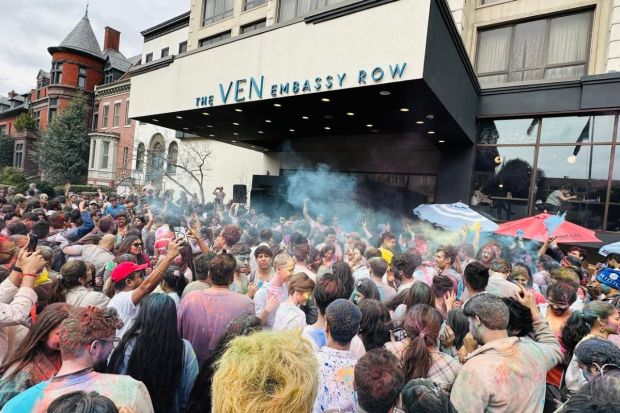 Outside The Ven at Embassy Row, students gathered in large numbers throwing colours and sharing their culture with peers. Holi in the US brough together the Indian diaspora from all walks of life. (Image: X)