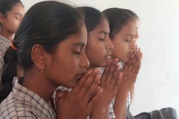 Students pray for the safe return of astronaut Sunita Williams in her ancestral village Jhulsana, Mehsana district, Gujarat. (Image Source: PTI)