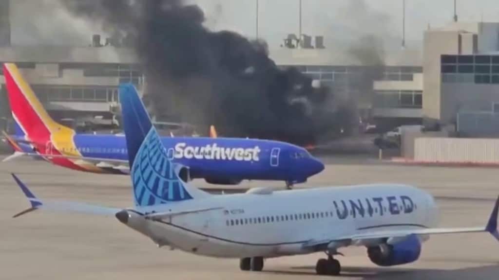 American Airlines flight catches fire at Denver Airport, passengers evacuated via emergency slides