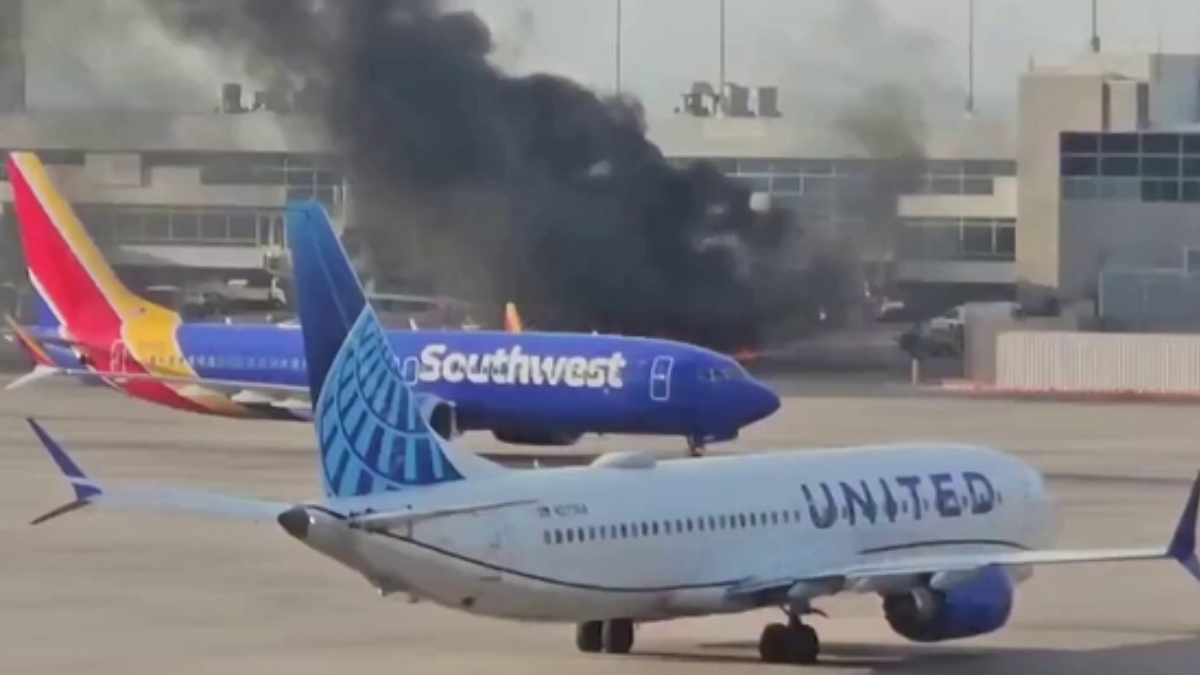 American Airlines flight catches fire at Denver Airport, passengers evacuated via emergency slides American Airlines flight catches fire at Denver Airport, passengers evacuated via emergency slides