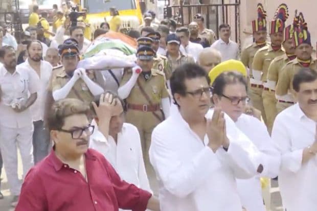Crowds gathered as the State facilitated Manoj Kumar's funeral. Fans, friends and family alike, they all reached his residence in Juhu to pay their respects. His films will forever be a testament to the patriotic spirit of India. (Image: ANI)