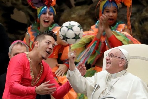 Pope Francis twirls a soccer ball he was presented by a member of the Circus of Cuba, during his weekly general audience in the Pope Paul VI hall, at the Vatican, Wednesday, Jan. 2, 2019.(Image Source: AP)