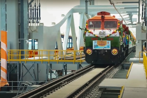 Rameswaram: A train passes over the newly-inaugurated Pamban sea bridge during the flag-off of the Rameswaram–Tambaram (Chennai) train service by Prime Minister Narendra Modi. (Image: PTI)