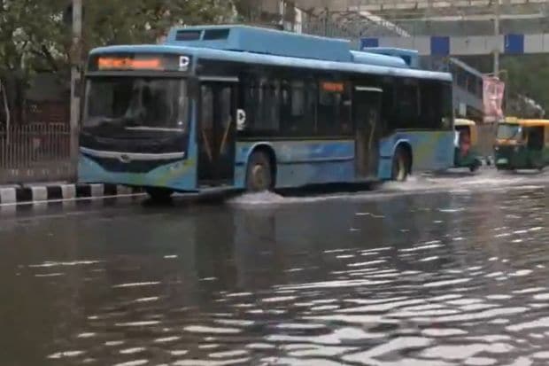 Single-lane traffic and slowed speeds of vehicles were seen in the ITO area. Roads clogged with water, the Sunday rains caused major infrastructural damage. (Image: ANI)