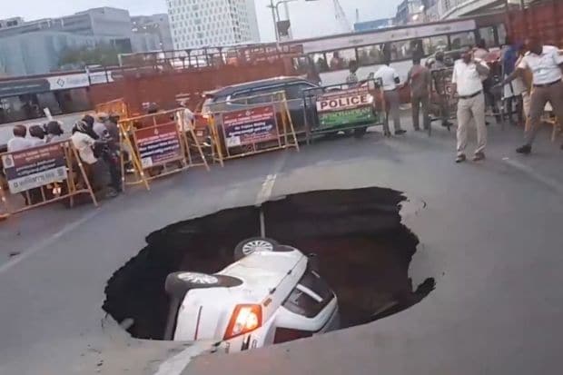 A horrific incident from Tamil Nadu shocked the officials as a pothole completely submerged a private vehicle. After rains caused major disruptions to the traffic, officials gathered to take control of the situation. (Image: IANS)