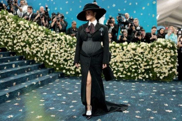 Another pregnancy news confirmed with Rihanna's big reveal in a power suit. As she welcomes her third child, she glowed in that corseted bodice which was a custom Marc Jacobs. (Image: AP)