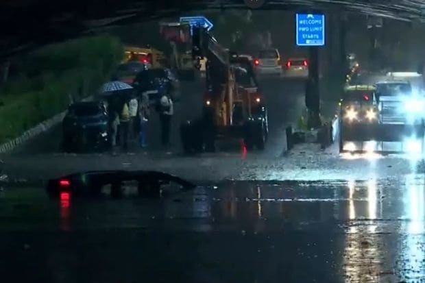 Visuals from Minto Road showed a car completely submerged under water. A huge damage to the car, even a crane was unable to provide relief. (Image: ANI)