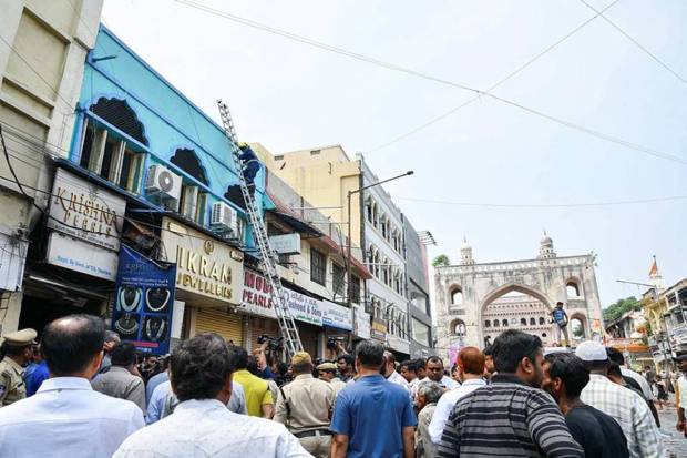 Firefighters conducts a rescue operation after a fire broke out at the Gulzar House near Charminar, in Hyderabad on Sunday. (Photo source: ANI)