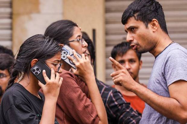 Panic-stricken people after a fire broke out in a building near Gulzar Houz in the Old City area of Hyderabad in Telangana. (Photo source: PTI)