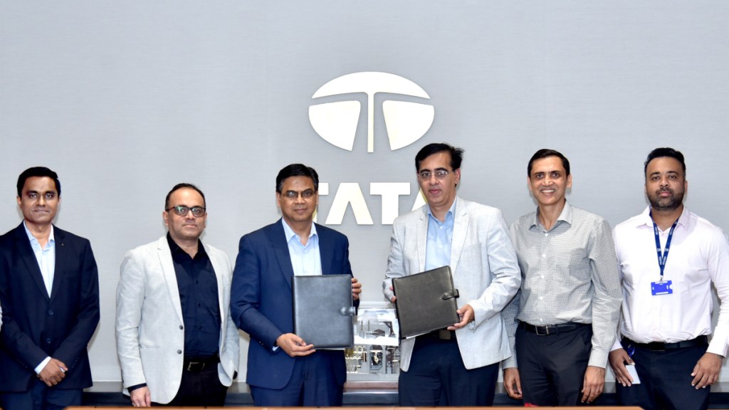 Girish Wagh, Executive Director, Tata Motors and Sandeep Gambhir, CEO, Vertelo, at the MoU signing ceremony, joined by delegates from Tata Motors and Vertelo