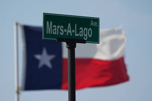 An unofficial street sign stands near a Texas flag as SpaceX's mega rocket Starship is prepared for a test flight from Starbase, Texas, Tuesday, May 27, 2025. (Photo source: AP)