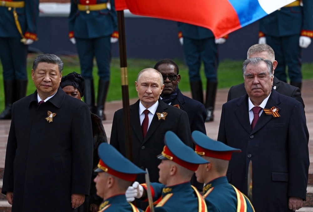 Russian President Vladimir Putin and Chinese President Xi Jinping watch the Victory Day military parade in Moscow Russian President Vladimir Putin and Chinese President Xi Jinping watch the Victory Day military parade in Moscow
