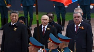 Russian President Vladimir Putin and Chinese President Xi Jinping watch the Victory Day military parade in Moscow