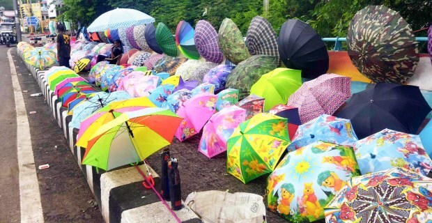 A display of colourful umbrellas on sale at a roadside as the monsoon season approaches in Bhopal. (ANI Photo)