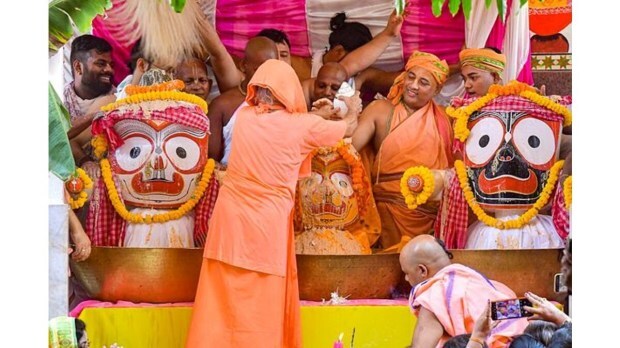 Hindu priests are performing 'Purnima Snana', a sacred bathing ritual for Lord Jagannath, Balabhadra, and Subhadra, at a temple in Agartala. (Image Source: PTI)