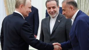 Russian President Vladimir Putin, left, greets Ambassador of Iran to Russia Kazem Jalali, right, and Iranian Foreign Minister Abbas Araghchi, center, prior to their talks at the Kremlin in Moscow (Photo: AP/PTI)